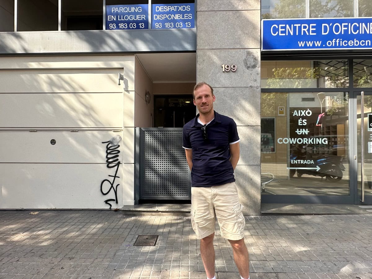 A man standing outside a building in Barcelona, Spain.