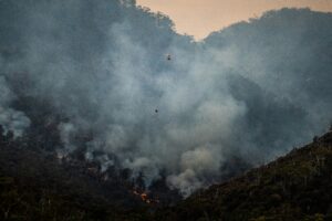 Forest fires in South Europe with fire fighting helicopter