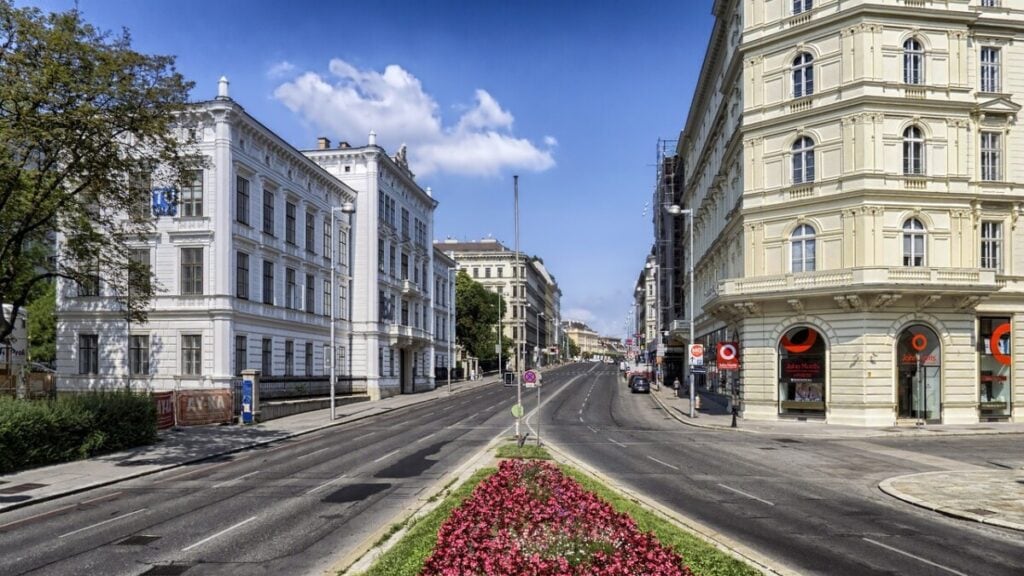 City with a wide road and historical buildings