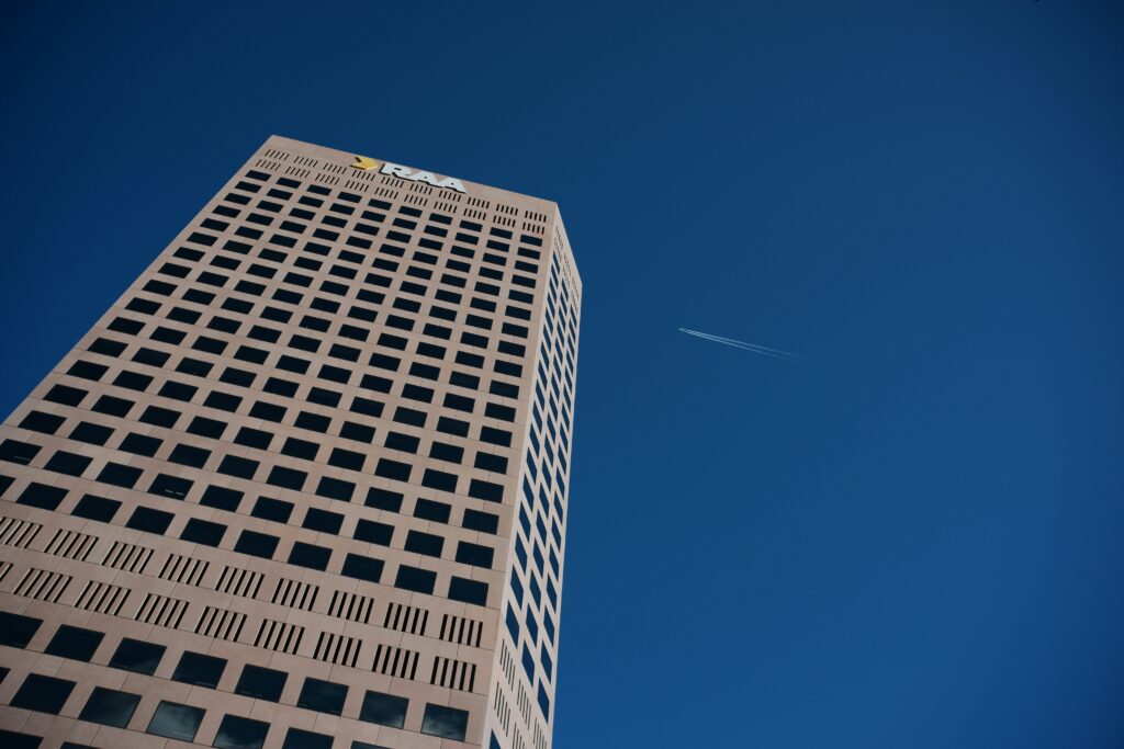 Skyscraper office building with airplane in the sky in Adelaide