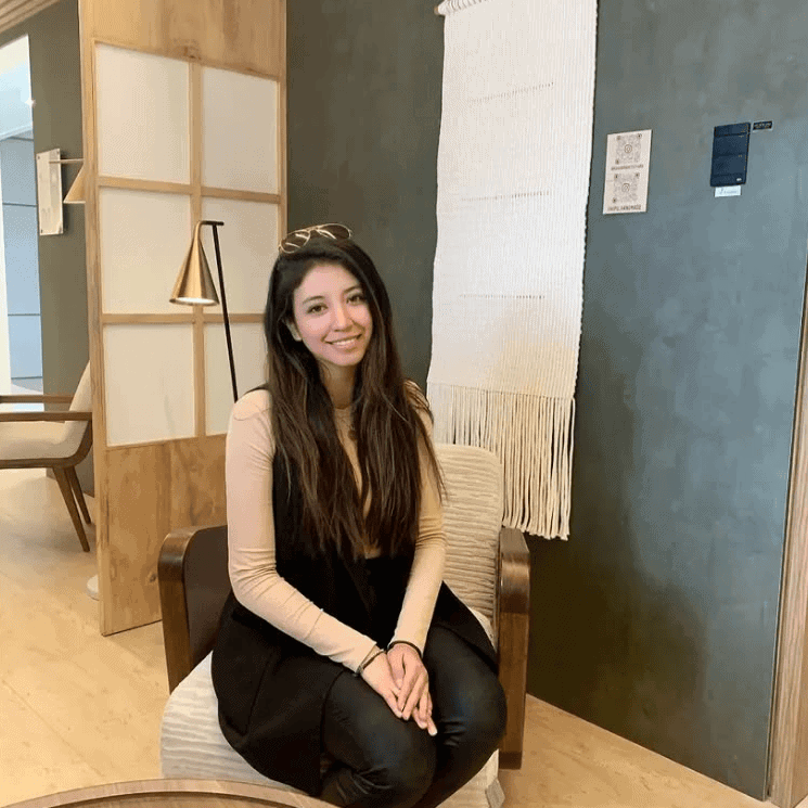 A woman sitting in a living room.