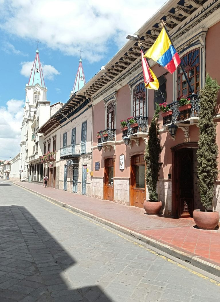 A street with colourful buildings at the historic center of Cuenca, Ecuador.