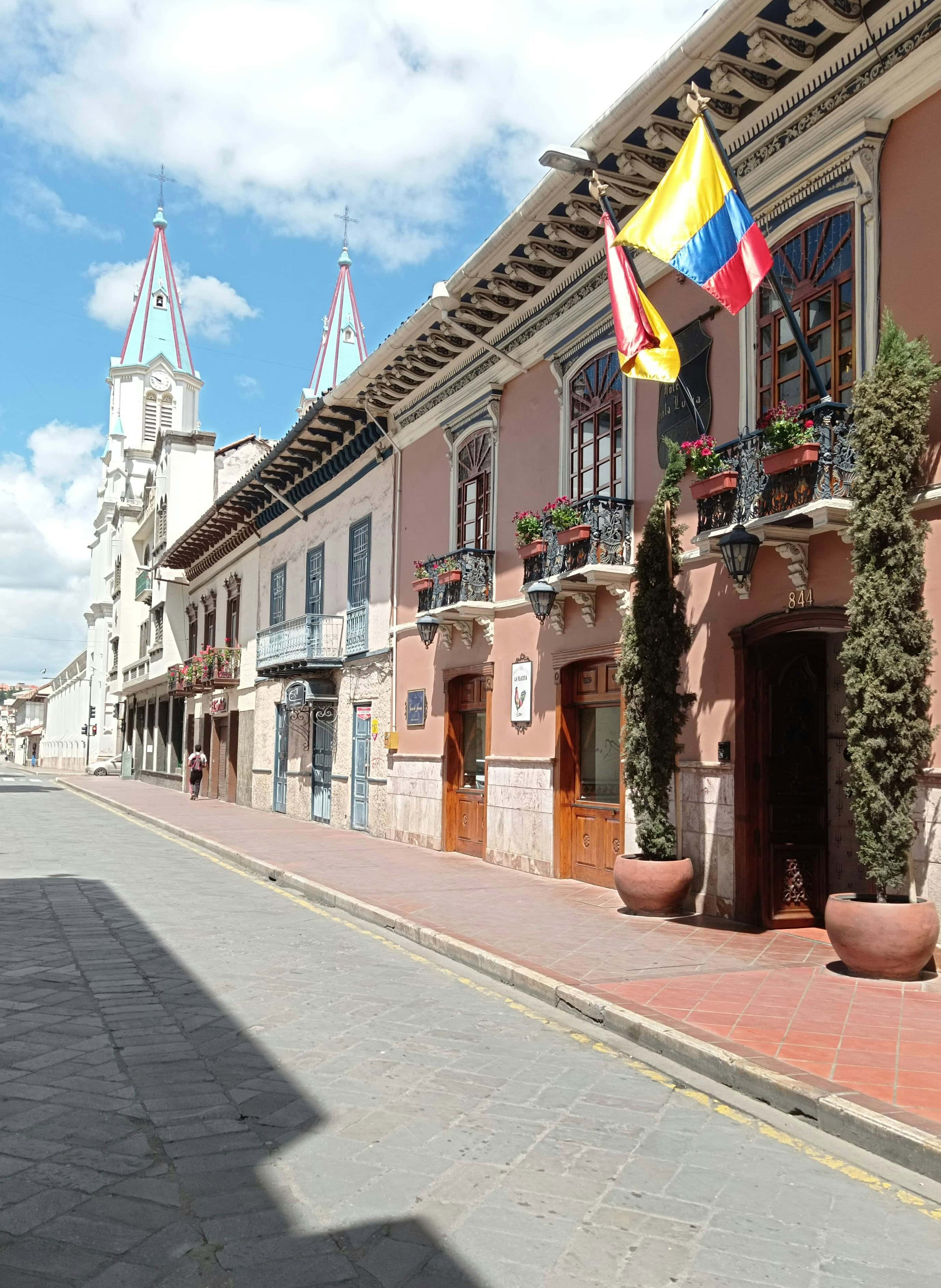A street with colourful buildings at the historic center of Cuenca, Ecuador.